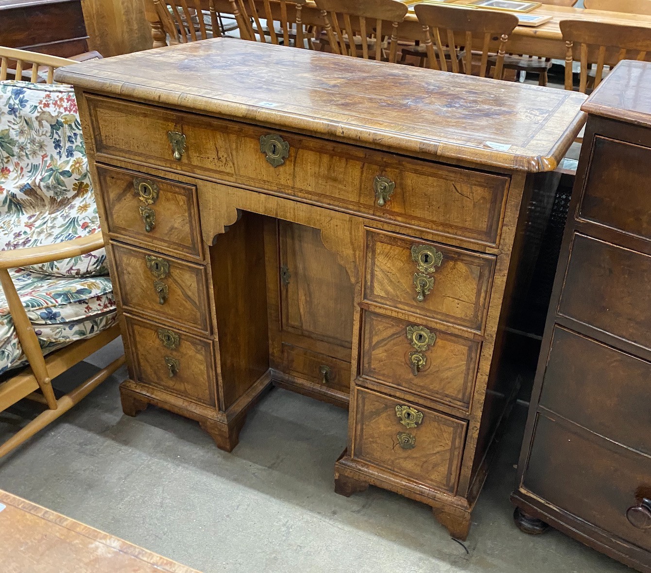 A George II feather banded walnut kneehole desk, length 99cm, depth 57cm, height 88cm